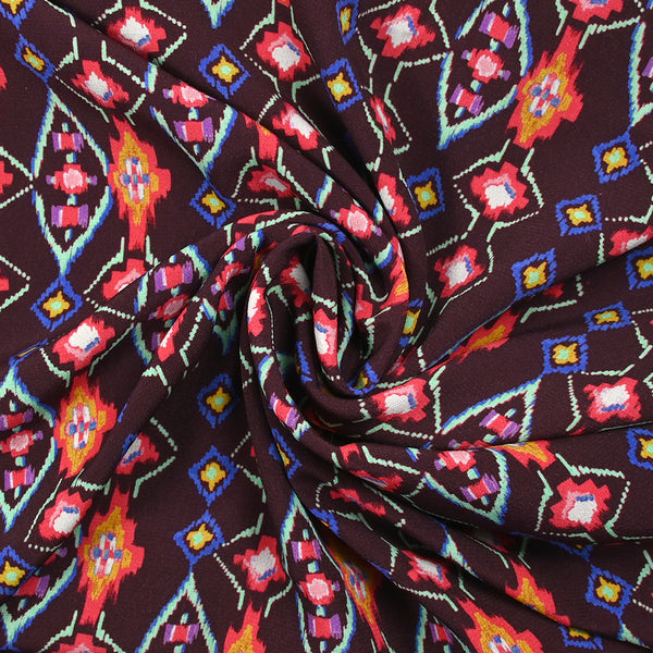 Crêpe viscose imprimé éclat mystique fuchsia et vert d'eau fond lie de vin