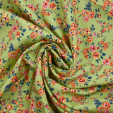 Viscose imprimée fleurs Pétunia fond vert