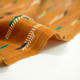 Polyviscose satiné ethnique fond camel