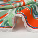 Viscose imprimée feuilles vert d'eau fond orange