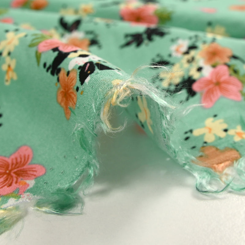 Viscose imprimée fleurs Marjolaine fond turquoise
