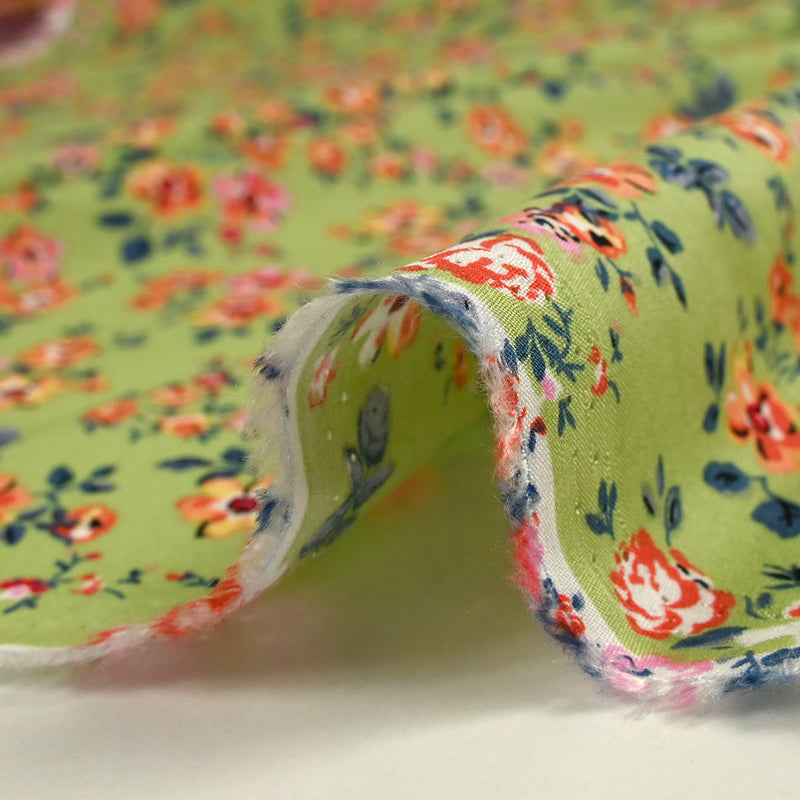 Viscose imprimée fleurs Pétunia fond vert