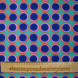 Coton imprimé rond rose, orange et bleu fond vert