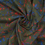 Crinkle muslin printed in royal blue and red with khaki background