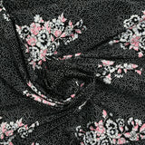 Maille de viscose satinée imprimé pois et fleurs fond noir