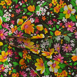 Coton imprimé vent floral orange et fuchsia fond marron
