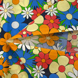 Coton imprimé floraison disco bleu roi, orange et jaune pâle