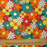 Algodón con estampado de flores disco en rojo, naranja y turquesa