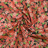 Cotton printed cherry blossoms coral pink black background