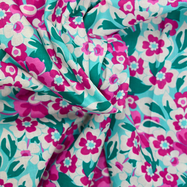 Cotton poplin printed flowers lina pink and green turquoise background