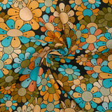 Coton imprimé flower power marron fond noir