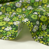 Coton imprimé prairie en fleurs anis fond vert foncé