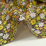 Coton imprimé prairie en fleurs jaune fond marron foncé