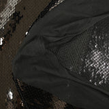Sequins noirs sur tulle stretch