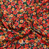 Maille crêpe imprimée fleurs rouges fond noir