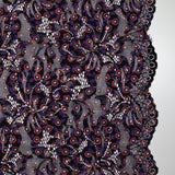 Dentelle festonnée imprimée fleurs rouge et violette fond noir