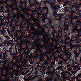 Dentelle festonnée imprimée fleurs rouge et violette fond noir