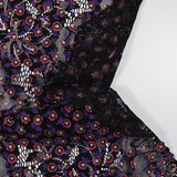 Dentelle festonnée imprimée fleurs rouge et violette fond noir
