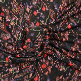Maille crêpe imprimée ethnique fond noir