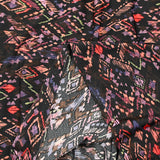 Maille crêpe imprimée ethnique fond noir