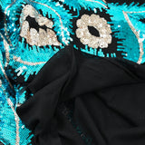 Maille sequin plumes royales argent et turquoise