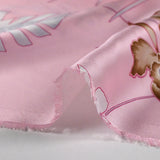 Satin polyester fin imprimé Hawaii fond rose