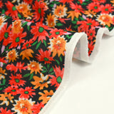 Maille crêpe imprimée fleurs rouges fond noir