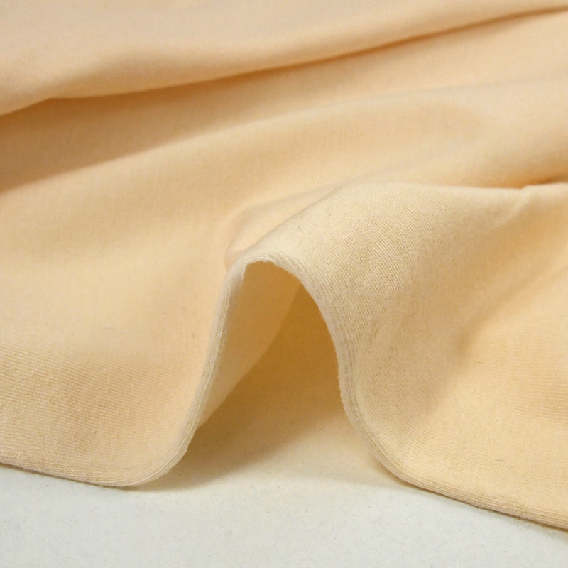 Jersey de coton fin pêche blanche