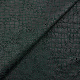 Maille dentelle ajourée impression reptile fond vert foncé