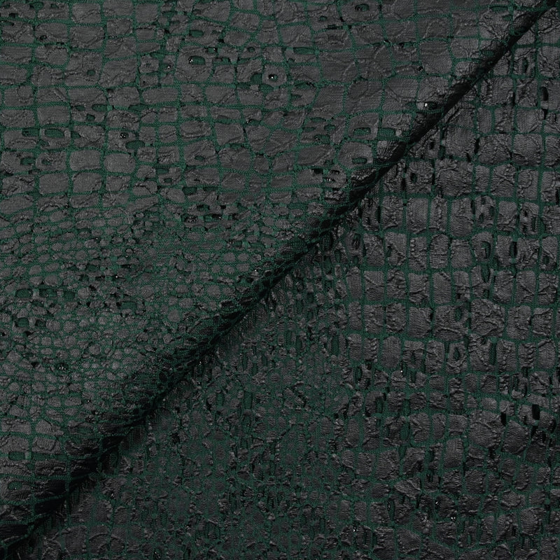 Maille dentelle ajourée impression reptile fond vert foncé
