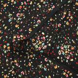 Mousseline imprimée crinkle confettis fond noir