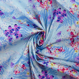 Popeline de coton imprimée l'ombre des fougères fond bleu layette