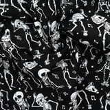 Coton imprimé Squelettes Rock’n’Roll blanc fond noir