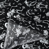 Coton imprimé Squelettes Rock’n’Roll blanc fond noir