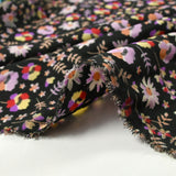 Microfibre imprimée envole-toi violet et rouge fond noir