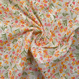 Broderie anglaise imprimée petites fleurs rose et jaune fond blanc