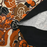 Viscose jersey printed field of orange and brown flowers on beige background