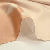 Satin polyester imprimé brume vert d'eau, orange brûlé et champagne