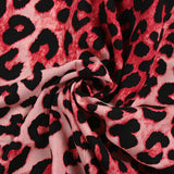 Printed viscose animal atmosphere red and pink background