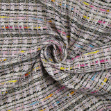 Tweed de polyester doré ligne multicolore fond blanc et rose clair