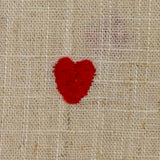 Viscose linen embroidered heart with string background