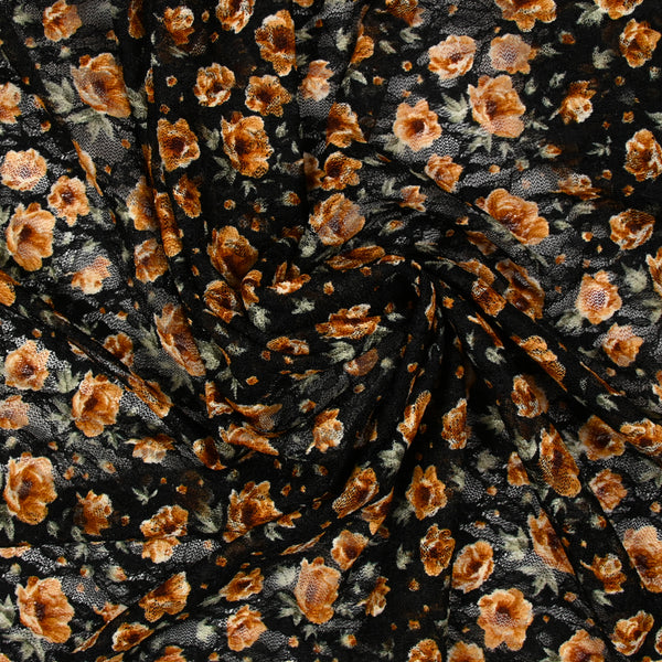 Dentelle imprimée fleurs camel fond noir