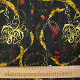 Printed muslin, satin band, chains and tassels, black background