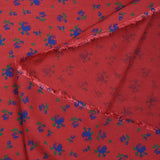 Polyviscose imprimée fleurs bleues fond rouge