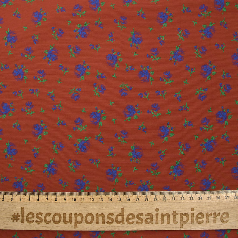 Polyviscose imprimée fleurs bleues fond brique