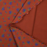 Polyviscose imprimée fleurs bleues fond brique