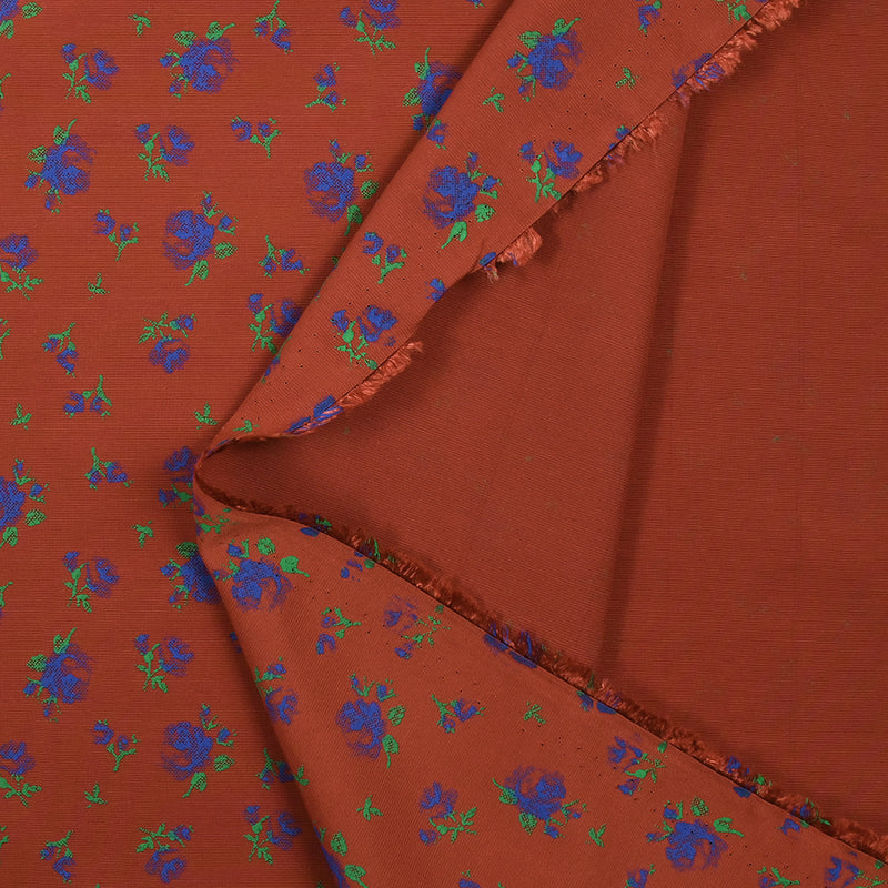 Polyviscose imprimée fleurs bleues fond brique