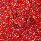 Crinkle chiffon printed iridescent daisy red background