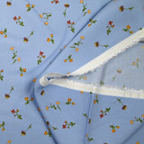 Viscose imprimée fleurette fond bleu ciel