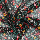 Mousseline crinkle imprimée irisée marguerite fond noir